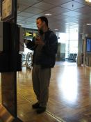 Matt in Helsinki Airport, drinking beer bought with Finn Air voucher, calling the bank